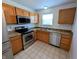 Updated kitchen boasts stainless steel appliances and ample counter space for easy meal prep at 581 Grassy Bend Dr, Greenwood, IN 46143