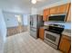 Modern kitchen featuring stainless steel appliances and ample counter space for cooking at 581 Grassy Bend Dr, Greenwood, IN 46143
