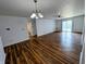Inviting living room featuring stylish floors, ceiling fan, and access to dining and bathroom at 581 Grassy Bend Dr, Greenwood, IN 46143