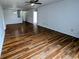 Well-lit living room with beautiful floors, ceiling fan, and an open layout at 581 Grassy Bend Dr, Greenwood, IN 46143