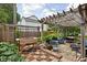 Outdoor backyard patio with wooden pergola and comfortable seating, perfect for relaxation at 6280 Washington Blvd, Indianapolis, IN 46220