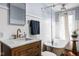 Bright bathroom with a clawfoot tub and a vanity with a marble countertop at 6280 Washington Blvd, Indianapolis, IN 46220