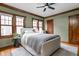 Comfortable bedroom with hardwood floors, ample natural light and neutral color scheme at 6280 Washington Blvd, Indianapolis, IN 46220