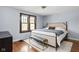Cozy bedroom featuring a large bed, a plush rug, and ample natural light at 6280 Washington Blvd, Indianapolis, IN 46220