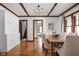 Charming dining room featuring hardwood floors, natural light, and classic trim at 6280 Washington Blvd, Indianapolis, IN 46220