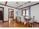 Bright dining room with hardwood floors, modern light fixture and natural light at 6280 Washington Blvd, Indianapolis, IN 46220