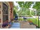 Inviting front porch with comfortable seating, decorative plants, and a welcoming blue striped rug at 6280 Washington Blvd, Indianapolis, IN 46220