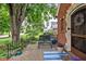 Inviting front porch with comfortable seating, decorative plants, and a welcoming blue striped rug at 6280 Washington Blvd, Indianapolis, IN 46220