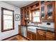 Bright kitchen featuring custom wooden cabinets, black countertops, and stainless steel appliances at 6280 Washington Blvd, Indianapolis, IN 46220