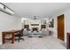 Bright, carpeted living room with a stone fireplace, built in shelving, and comfortable seating area at 6280 Washington Blvd, Indianapolis, IN 46220