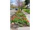 Charming street view featuring vibrant tulip flower bed at 6280 Washington Blvd, Indianapolis, IN 46220