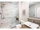 Sleek bathroom with marble shower, modern toilet, and minimalist vanity at 630 N College Ave # 409, Indianapolis, IN 46204