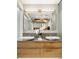 Contemporary bathroom vanity features double sinks, modern fixtures, and wood cabinets at 630 N College Ave # 409, Indianapolis, IN 46204