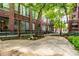 A building courtyard with a concrete walking path at 630 N College Ave # 409, Indianapolis, IN 46204