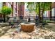 Brick courtyard and fire pit surrounded by bench seating at 630 N College Ave # 409, Indianapolis, IN 46204