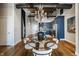 Elegant dining area with a modern table, stylish chandelier, and view into the gourmet kitchen at 630 N College Ave # 409, Indianapolis, IN 46204