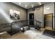 Hallway with gray block walls, tiled floors, a bench, and stairway at 630 N College Ave # 409, Indianapolis, IN 46204