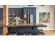 Gorgeous kitchen with stainless steel appliances, beautiful backsplash, and stone countertop island with seating at 630 N College Ave # 409, Indianapolis, IN 46204