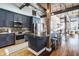 Stunning modern kitchen with dark blue cabinets, stainless steel appliances, and a large island with seating at 630 N College Ave # 409, Indianapolis, IN 46204