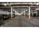 Brightly lit parking garage with painted support beams at 630 N College Ave # 409, Indianapolis, IN 46204