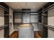 Spacious walk-in closet with custom shelving and a center island for organization at 630 N College Ave # 409, Indianapolis, IN 46204