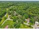 Expansive wooded property featuring lush greenery, homes, and ponds for tranquil living at 6691 N Baltimore Rd, Monrovia, IN 46157