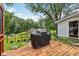 Wooden back deck with covered grill overlooking a backyard, plus view of property at 6691 N Baltimore Rd, Monrovia, IN 46157