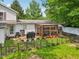 Cozy back patio with deck and screened-in porch at 6691 N Baltimore Rd, Monrovia, IN 46157