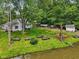 Expansive backyard featuring a deck, mature trees, and lush greenery, perfect for outdoor living at 6691 N Baltimore Rd, Monrovia, IN 46157