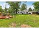 Spacious backyard featuring a pond, seating area, well maintained lawn with lush trees and greenery at 6691 N Baltimore Rd, Monrovia, IN 46157