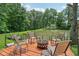 Relaxing outdoor deck space featuring comfortable seating and a fire pit overlooking a serene pond and lush greenery at 6691 N Baltimore Rd, Monrovia, IN 46157