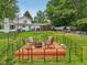Cozy backyard with fire pit, deck, seating, and fenced in area at 6691 N Baltimore Rd, Monrovia, IN 46157