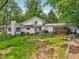 Spacious backyard with screened-in patio, deck, and a grill at 6691 N Baltimore Rd, Monrovia, IN 46157