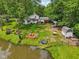 A high angle aerial view of the backyard with pond at 6691 N Baltimore Rd, Monrovia, IN 46157