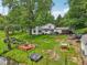A full aerial view of the backyard with pond and deck at 6691 N Baltimore Rd, Monrovia, IN 46157