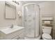 Compact bathroom with a white shower stall, vanity, and tiled floor at 6691 N Baltimore Rd, Monrovia, IN 46157