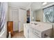 Bright bathroom featuring white vanity, decorative mirror, and tiled floor at 6691 N Baltimore Rd, Monrovia, IN 46157