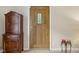 Home entryway featuring a paneled wood door, cabinet, and neutral walls at 6691 N Baltimore Rd, Monrovia, IN 46157