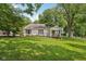 Charming single-story home with a cozy front porch, well-maintained lawn, and mature trees at 6691 N Baltimore Rd, Monrovia, IN 46157