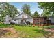 Exterior backyard featuring a chicken coop and a fenced-in garden bed, and lovely wood patio at 6691 N Baltimore Rd, Monrovia, IN 46157