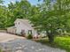Charming home with a well-manicured lawn and a welcoming front porch, surrounded by mature trees at 6691 N Baltimore Rd, Monrovia, IN 46157