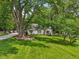 Charming home with a well-manicured lawn and a welcoming front porch, surrounded by mature trees at 6691 N Baltimore Rd, Monrovia, IN 46157