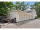 Spacious three-car garage with ample parking space and convenient side access surrounded by nice landscape at 6691 N Baltimore Rd, Monrovia, IN 46157