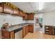 Well-lit kitchen with wood-look floors and stainless steel appliances at 6691 N Baltimore Rd, Monrovia, IN 46157