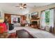 Bright living room featuring a fireplace and access to the dining room at 6691 N Baltimore Rd, Monrovia, IN 46157