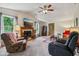 Open living room with fireplace, ceiling fan, and comfortable seating at 6691 N Baltimore Rd, Monrovia, IN 46157
