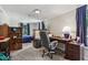 Office space featuring dark wood desk and view into the bedroom at 6691 N Baltimore Rd, Monrovia, IN 46157