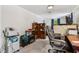 Office space featuring dark wood desk and view into the bedroom and green backyard at 6691 N Baltimore Rd, Monrovia, IN 46157