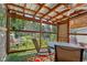 Covered patio with outdoor seating, ceiling fan, turf carpet, and view of backyard at 6691 N Baltimore Rd, Monrovia, IN 46157