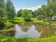 Scenic view of a tranquil pond surrounded by lush greenery, offering a peaceful and serene setting at 6691 N Baltimore Rd, Monrovia, IN 46157
